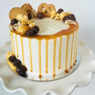 vanilla caramel cake, buttercream icing, candy, chocolate