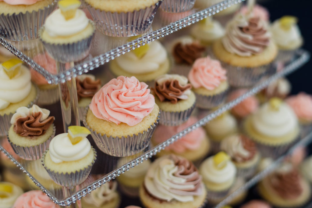 Close up of cupcake tower with regular and mini cupcakes